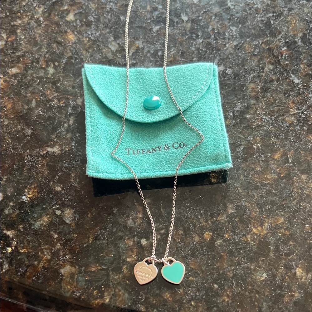 Auth Tiffany & Co. Silver Necklace with Silver/Blue enamel Heart Charms. 18”